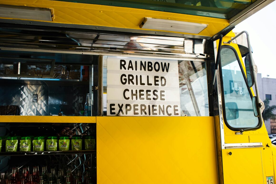 yellow food truck with sign